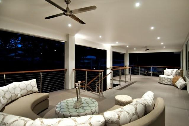 Covered outdoor living area with ceiling fans and downlights shown in Etronic's ServiceSeeking gallery