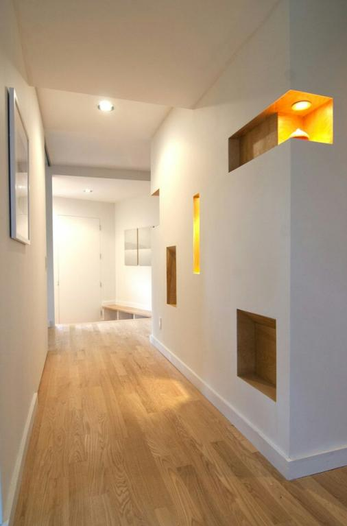 Bright hallway with recessed and feature lighting shown in Etronic's ServiceSeeking gallery